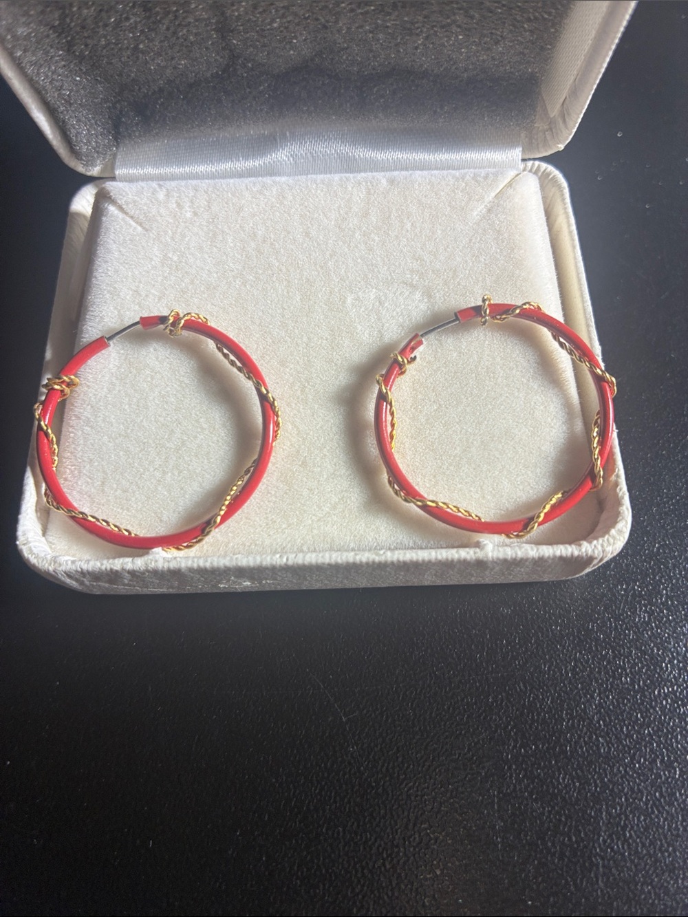 Red hoop earrings with gold wire wrapped around